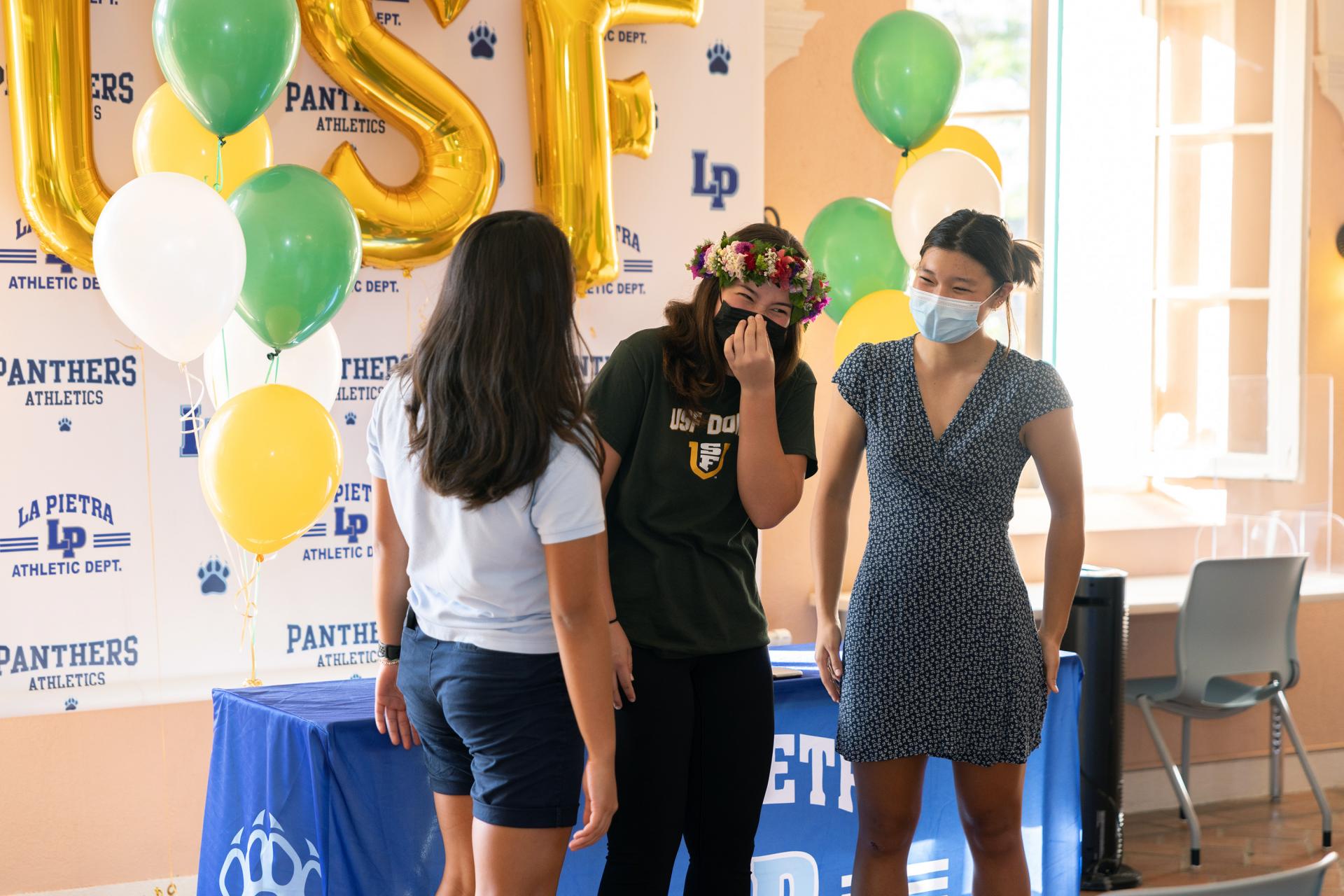 Chee with teammates Esther J. (left) and Dayna N. (right)