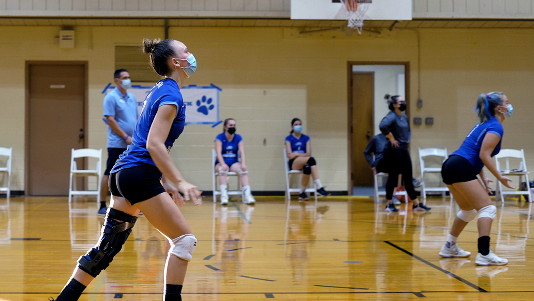 Ava. A gets ready to return the ball