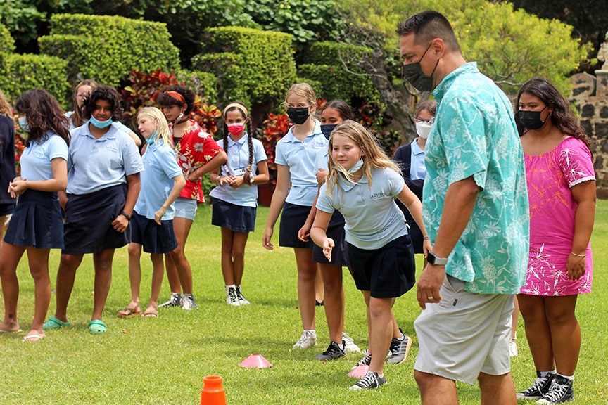 Athletics Director Ross Kinsler oversees students playing moa pahe’e.