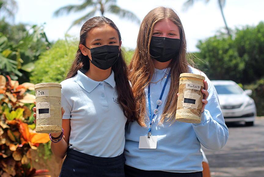 7th graders Louisa R. and Maila S. head back to the darkroom after selecting subjects for their pinhole photos.