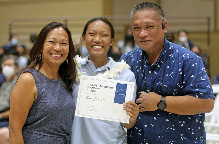 Parents congratulate Nina Jade B. after winning the Highest Academic Standing award for the junior class. Nina also received The Nicole Howe Award along with others recognizing her excellence in math and athletics. 