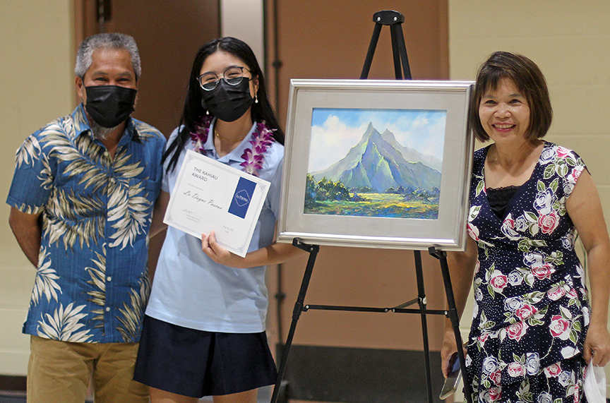 La Dayne P. and parents pose with the painting by artist Michael Powell after the senior received the Alice Guild Kahiau Award. Every year, Powell donates a one-of-a-kind art piece to the award winner.