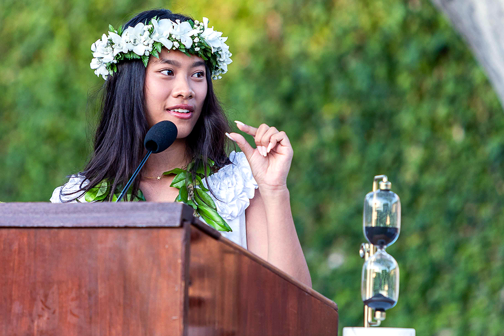 Valedictorian Victoria H. urges her class to take advantage of every opportunity in the little time they have.