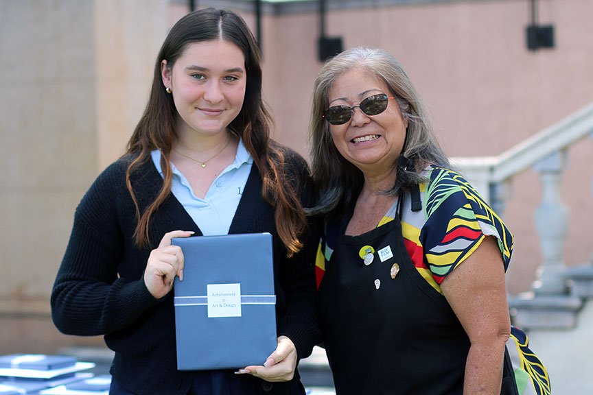 Mehana B. with Mrs. Tesoro after earning the Achievement in Art & Design Award