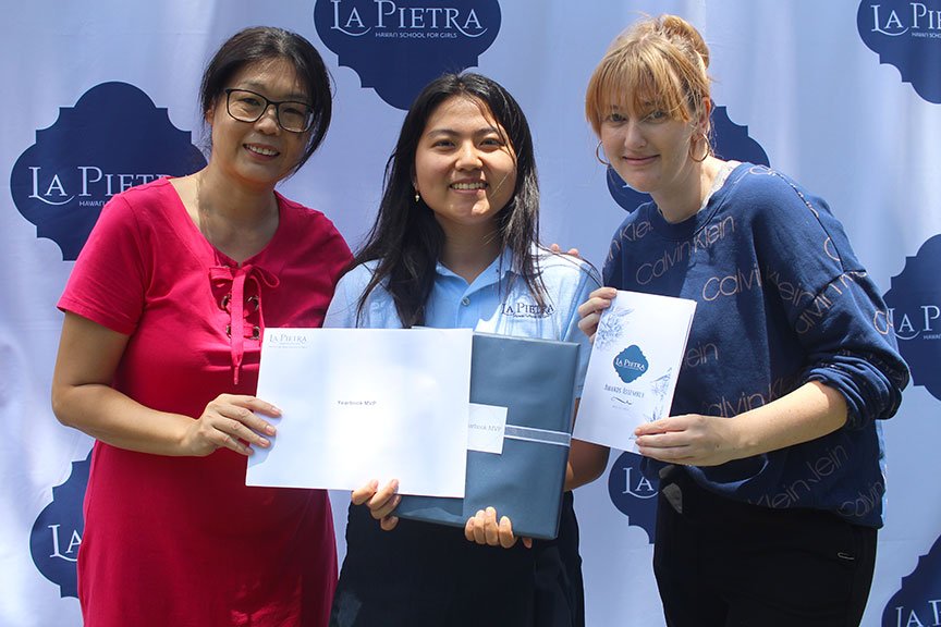 Megu K. and advisors Ms. Huang and Ms. Wiseman after being named Yearbook MVP