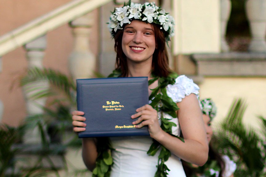 Morgan S. receives her diploma. 