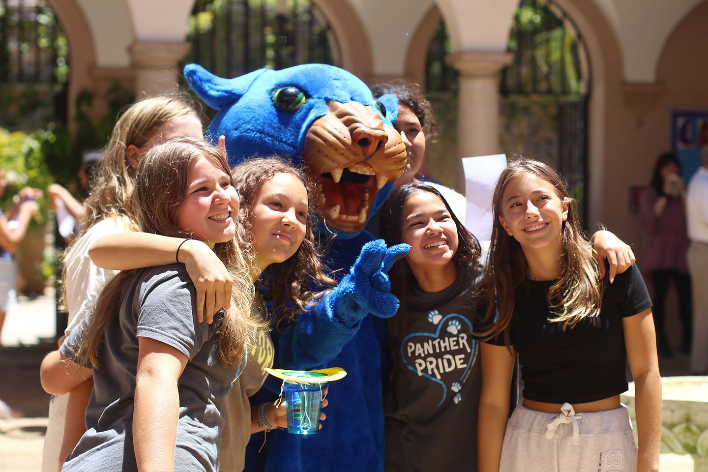 Students pose and celebrate with the La Pietra Panther.