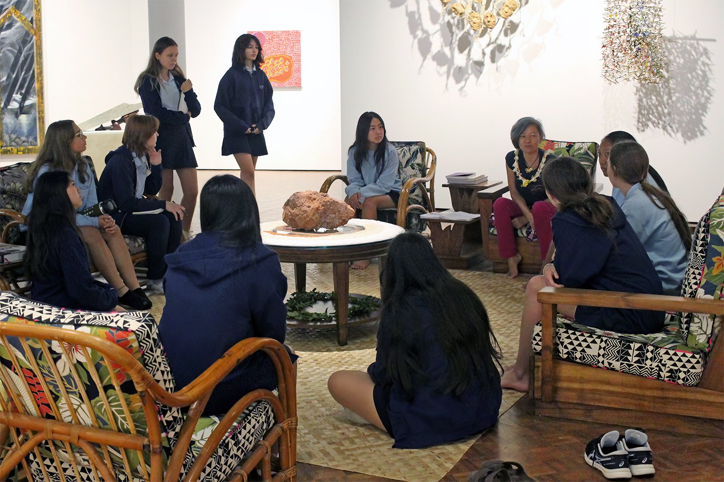 Students from Civics in Hawaii and Social Justice Art classes enjoy a special tour of ʻAi Pōhaku, Stone Eaters, led by curator and La Pietra alumna Noelle M.K.Y. Kahanu ’82, at the UH Mānoa Art Gallery.