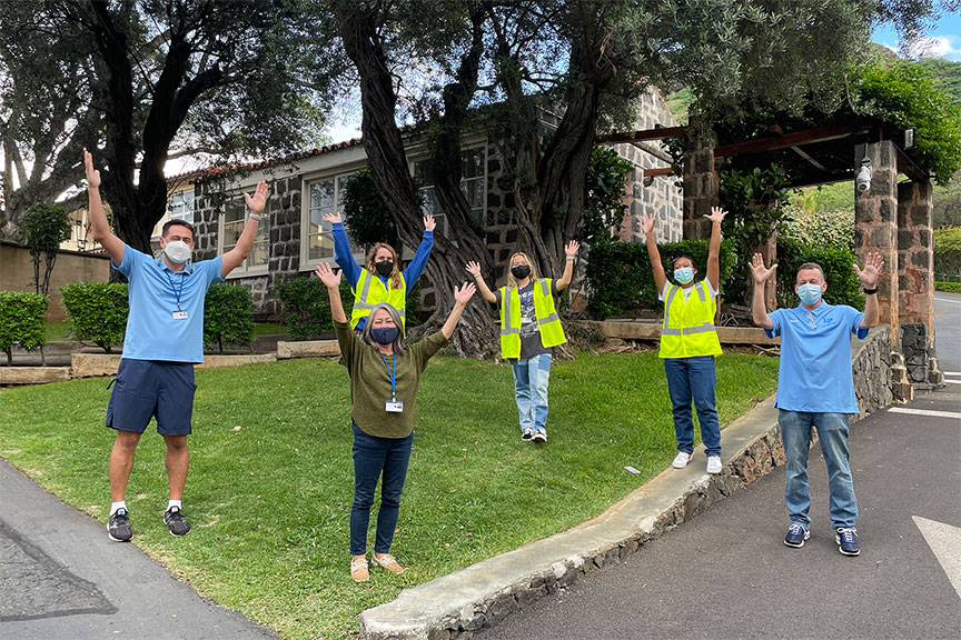 Members of the varsity basketball team, parents, faculty and staff help community members get vaccinated.